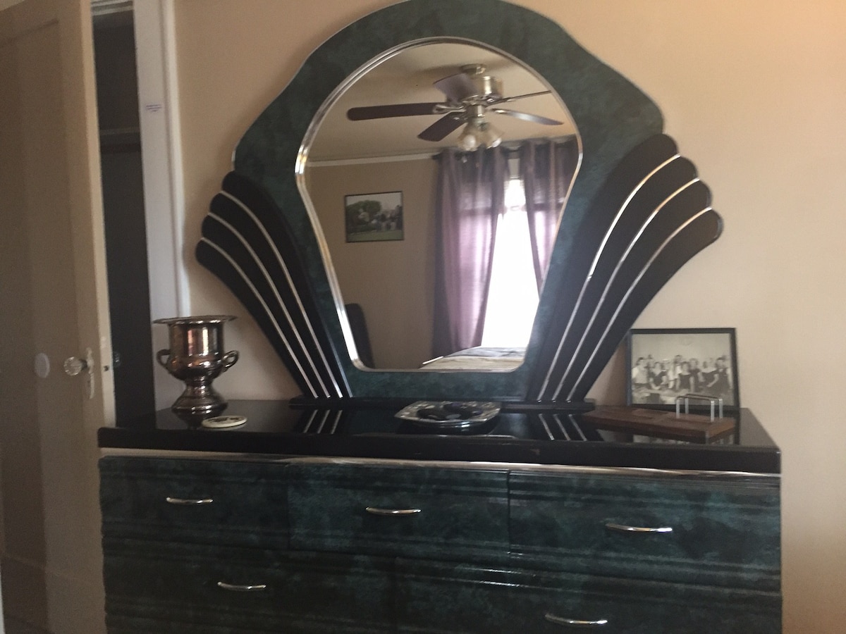 Art deco dresser with a Winners Cup & some other memorabilia.